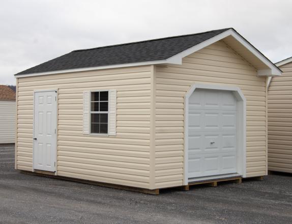 12x16 Custom Peak Storage Shed with overhead door and shelves