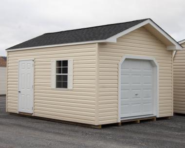 12x16 Custom Peak Storage Shed with overhead door and shelves